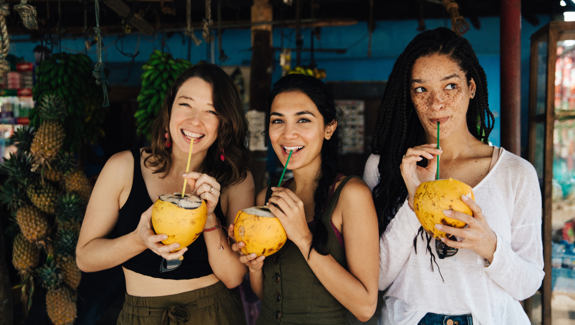 woman-drinking-coconut-vacation